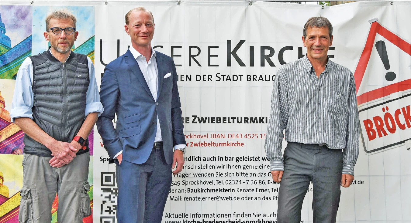Jörg Valentin,  Daniel Rasche und Pfarrer Arne Stolorz